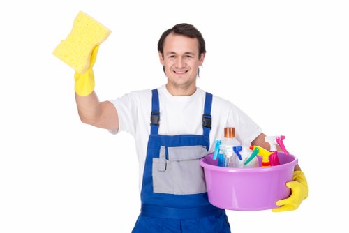 Technician preparing carpet cleaning equipment in a safe work area