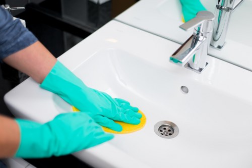 Office cleaners in Westkensington vacuuming and refreshing a modern workplace