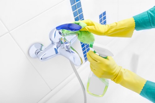 Professional West Kensington carpet cleaners improving a busy room's carpet appearance